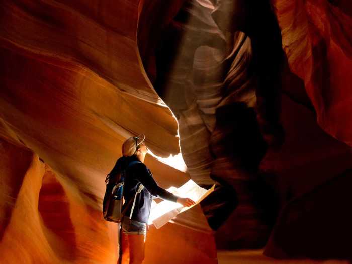 Walk through Antelope Canyon, located on Navajo land near Page, Arizona, to see its intricate shape and lighting throughout the day.