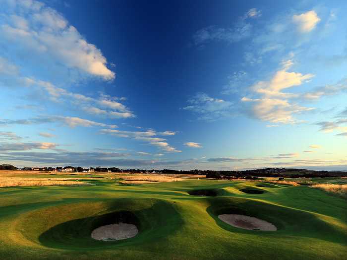 Play Muirfield in East Lothian, Scotland. The golf course is one of the oldest in the world, and was the host of the 2013 British Open.