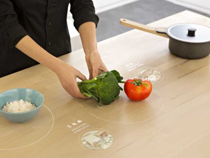 For tiny apartment dwellers, the table eliminates the need for a stove. Hidden induction coils heat the inside of pots and pans rather than the surface to make the table amenable to working, cooking, or eating.