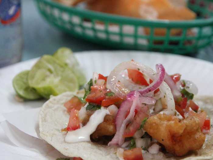 ENSENADA, MEXICO: The Ensenada market made waves with its fish tacos when it opened in 1958 and the dish remained one of the area’s most famed bites. Today, you’ll find stands all around the area serving up the iconic combination of fried fish and shrimp smothered in mayo, salsa, and fresh cabbage.