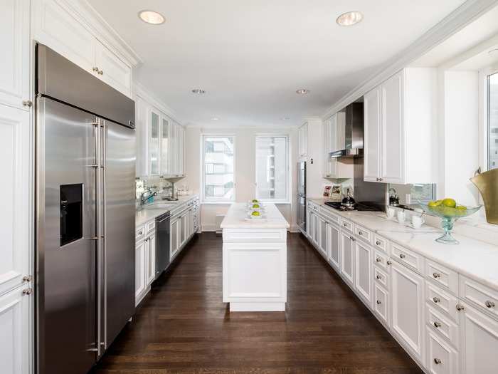 The kitchen has a railroad-style layout, with tons of counter space and a center island — offering plenty of room for a private chef to work.