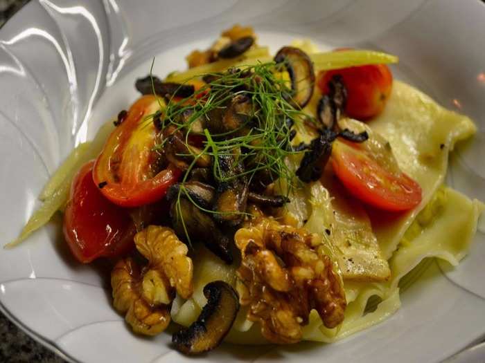 This dish of homemade ravioli, grilled vegetables, and crunchy walnuts was served at Casa SaltShaker.