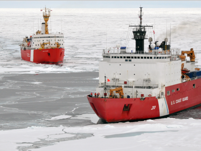 The ice breakers have conducted scientific missions as well. Here, the Healy (right) and a Canadian Coast Guard ship pry the Arctic Ocean as part of a project to map the limits of the US and Canada