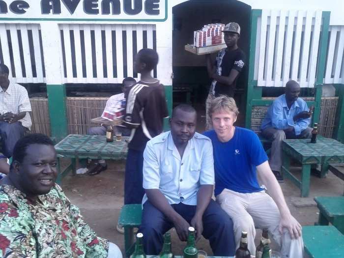 Here Garfors enjoys a beer with a local policeman and cassette tape salesman in N’Djamena, the capital and largest city in Chad.