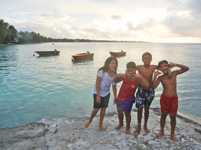 These children in Tuvalu, a Polynesian island between Hawaii and Australia, invited Garfors to go swimming with them. Garfors says Tuvalu will be the first country to disappear if ocean levels continue to increase.