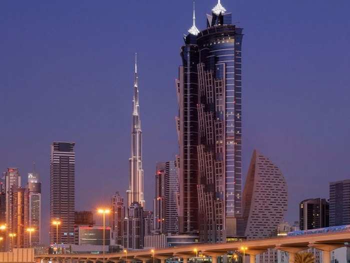 TALLEST HOTEL: Dubai’s JW Marriott Marquis Hotel is 1,165.84 feet high and has two towers that reach 72 floors.  7There’s a lounge bar on its top floor where you can see skyscraping views of the city.