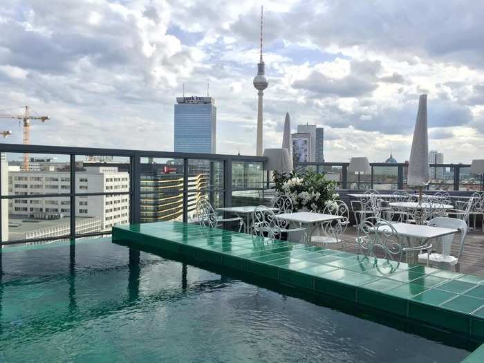 The trendy Soho House in Berlin, Germany, offers chic hotel rooms and loft spaces as well as a rooftop pool that has an unobstructed view of the city