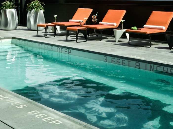 The SIXTY LES Hotel rooftop pool is a place to "scene and be seen" in New York City. The art-inspired pool has Andy Warhol photos on its floor.