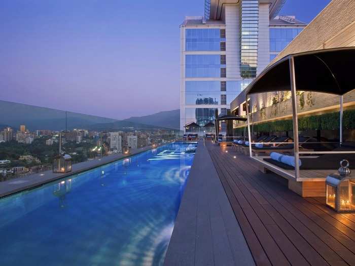 Set against the majestic Andes mountains, the long narrow rooftop pool at the W in Santiago, Chile, has only a thin glass barrier separating swimmers from incredible views of the city.