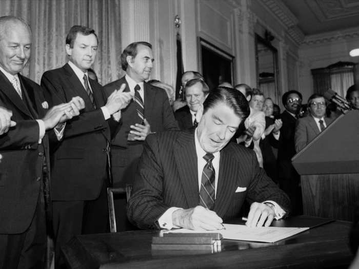 The act has been amended several times since 1965 to further expand its protections. Here, President Ronald Reagan signs a 1982 version of the act.