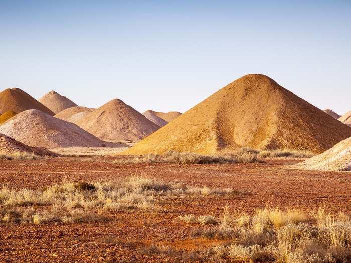 Dug up by miners for years, the area is surrounded with piles of excavated sand, some of which still hide precious opal gemstones.