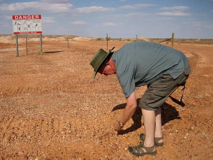 Many tourists come to Coober Pedy to try and find the colorful stones.