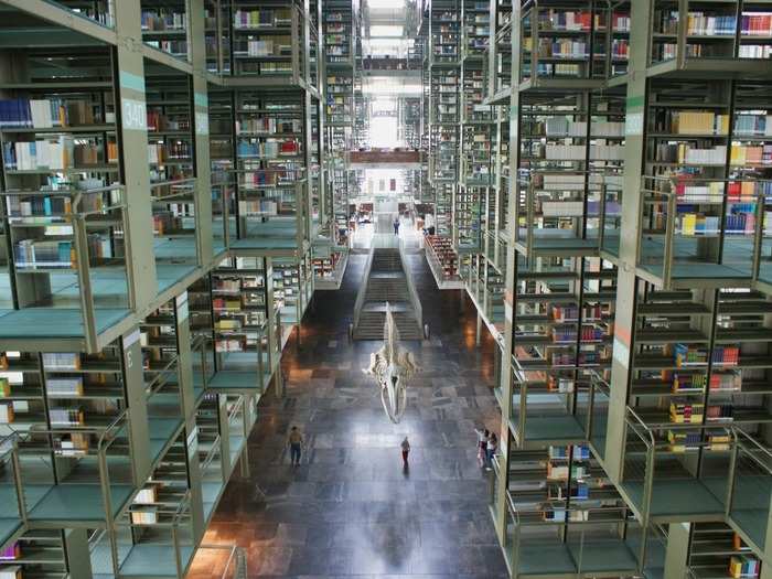 Along with the skeleton that hangs in the middle of the Pedro Vásquez Library in Mexico City, Mexico, the bookshelves in the library also appear to be hanging. The library is named after a Mexican philosopher and politician.