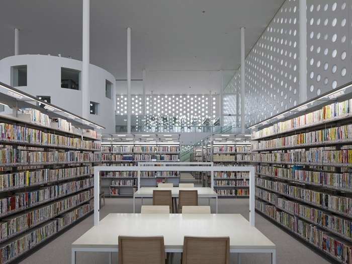 The hole punch-like windows in the Kanazawa Umimirai Library in Kanazawa City, Japan, are meant to make the library look like a forest of books. The goal of the  library