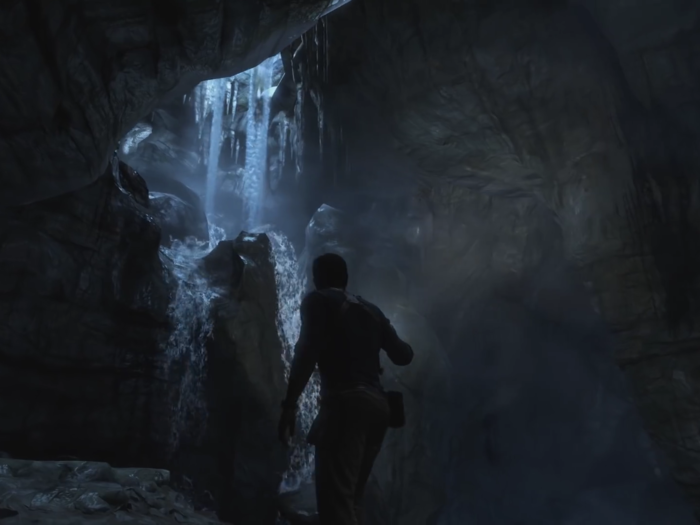 Treasure hunter Nathan Drake is exploring a dark cavern. He