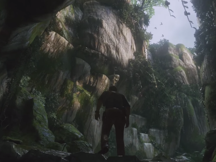 Drake emerges from the cave and steps into a gorgeous-looking jungle. The sunlight reflecting off the rocks is particularly striking.