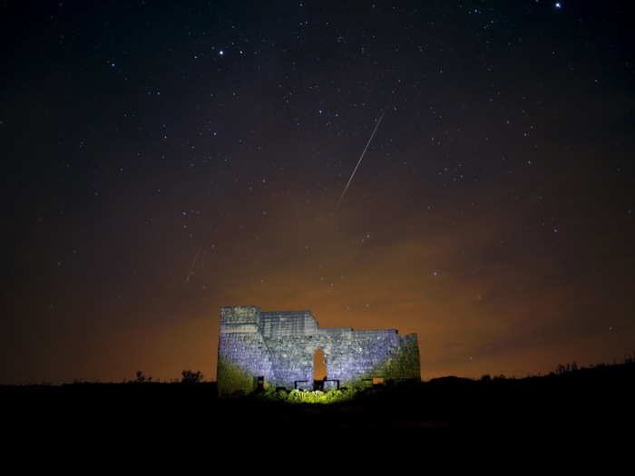 Shooting stars fly over the remains of a Roman theatre in southern Spain.