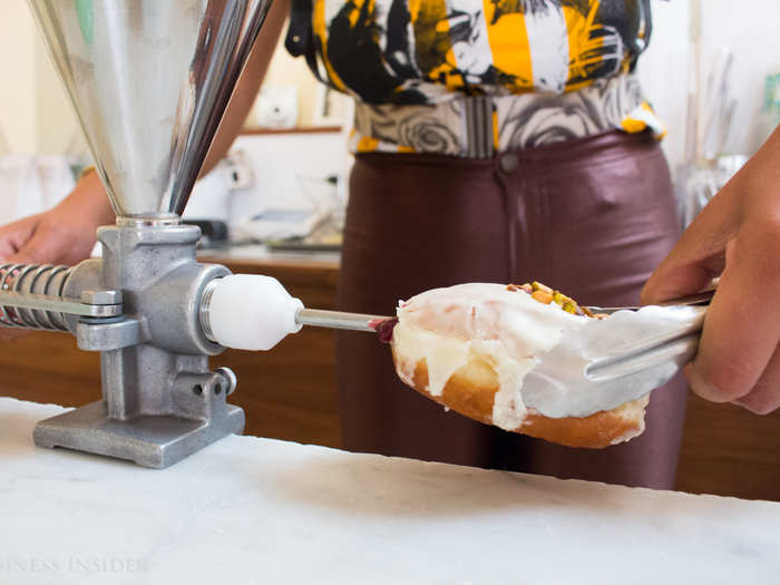 Customers can mix and match the pillowy pastries with one of four fillings from a rotating menu. I opted for the lemon-pistachio doughnut filled to order with strawberry jam. It. Was. Divine.