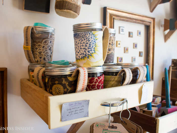 I found tree branches repurposed as candlestick holders, an armoire turned on its side and used as a kitchen island, and cloth remade into Mason jar cozies.