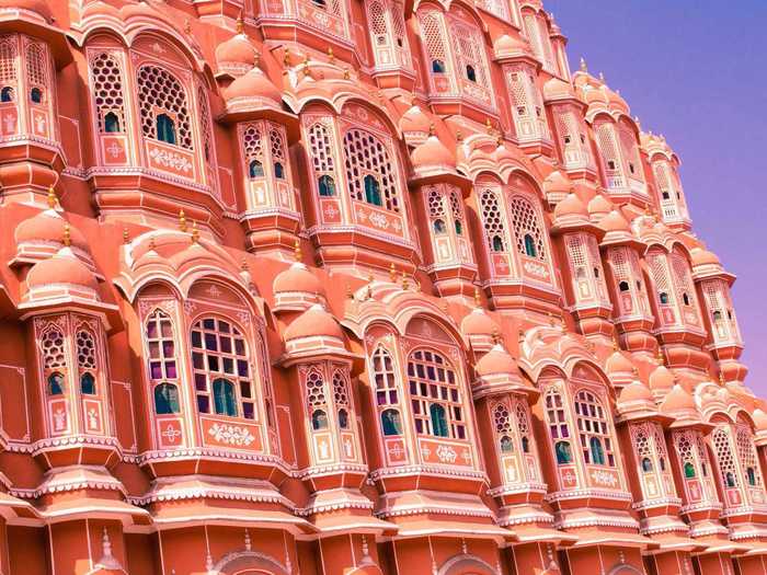 The intricate design of the five-story Hawa Mahal, or Palace of the Winds, in Jaipur was meant to allow royal women to watch street festivities from the confines of the palace since they weren