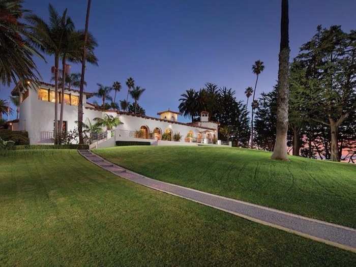 Restored and modernized in 1927, the 9,000-square-foot main residence includes five bedrooms, a grand main room, a den, a bar, and a guest suite.