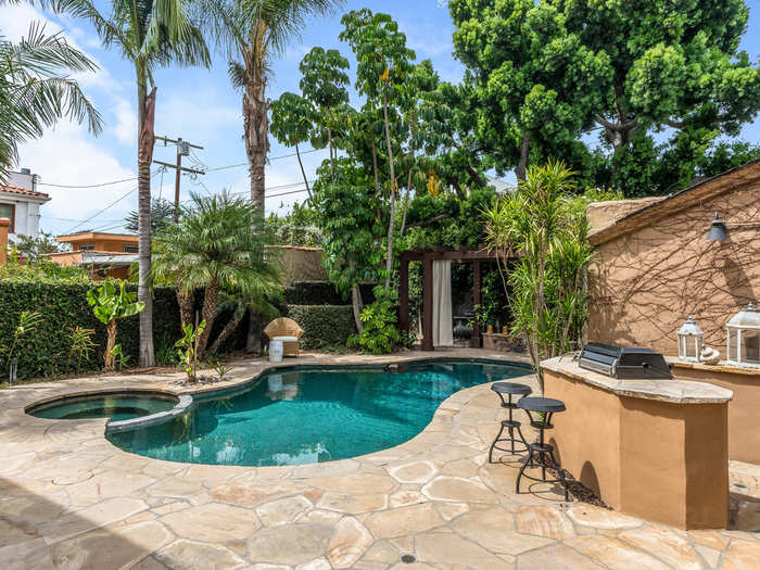 The couple redid their backyard in 2005, aiming for a more tropical feel they could enjoy with their two dogs.