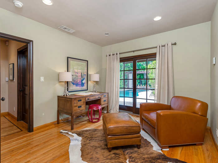 This sitting room could conceivably be used as another bedroom.