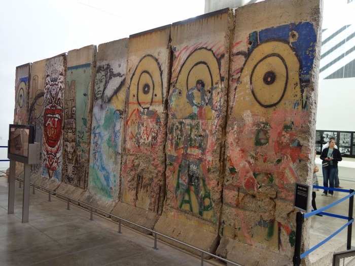 The Newseum, an interactive museum of news and journalism in Washington, D.C., houses eight 12-foot-high concrete sections of the Berlin Wall. Next to them, you