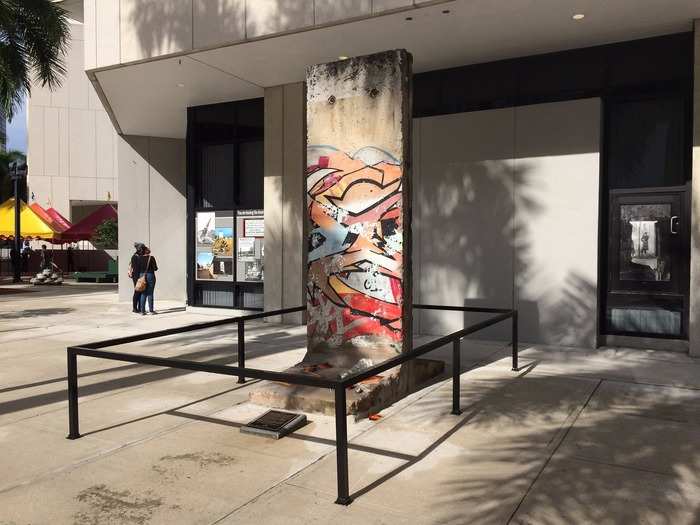 This portion of the Berlin Wall traveled from Hamburg to Miami Dade College’s Wolfs Campus in Miami, Florida, last year. On the day of its unveiling, around 1,500 people gathered at the campus with German flags to commemorate the 25th anniversary of the fall of the wall.