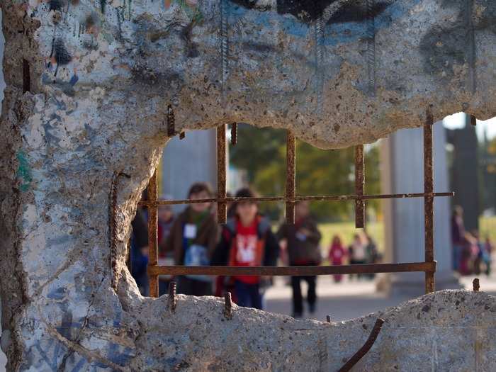 Children play in a park in Torrejon de Ardoz, Spain, where a section of the Berlin Wall resides.