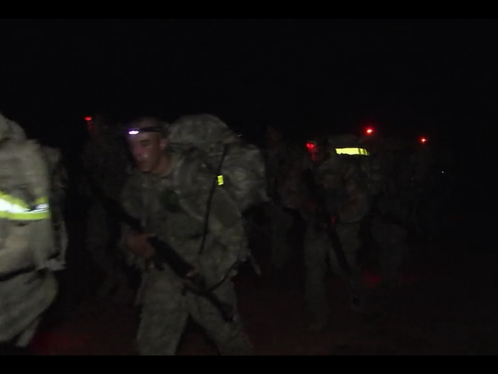 Once everyone completes the obstacle course, they take their 60 pounds of gear and begin the 15-mile march back to the barracks.