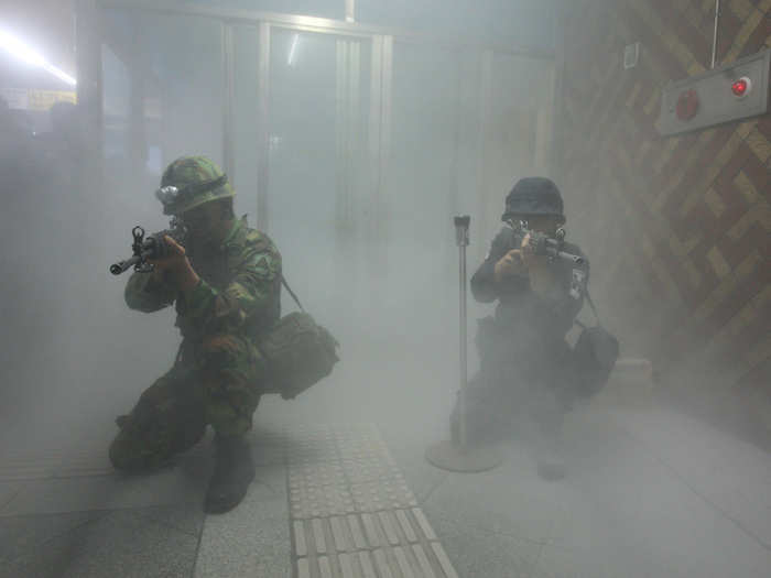 Here, a South Korean police officer, right, and an army soldier aim their weapons during an anti-terror exercise.