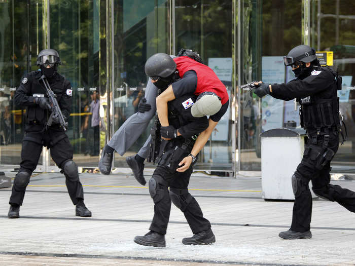 During anti-terror drills, South Korean policemen practice securing and locking down buildings in major cities.