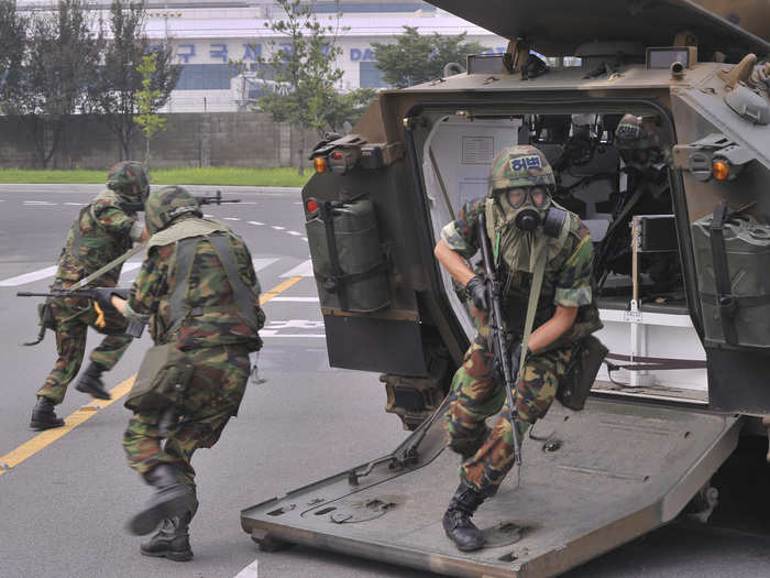 Here, South Korean soldiers practice deploying in response to threats in downtown Seoul.