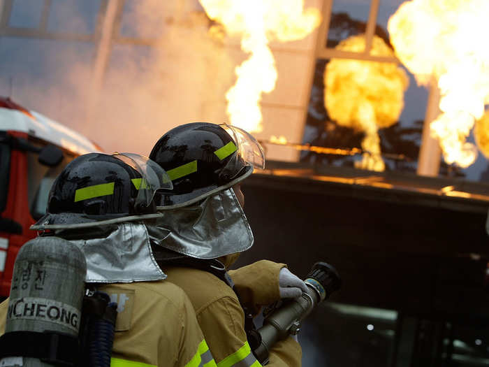 Here, the firefighters participate in an anti-terror and anti-chemical drill.