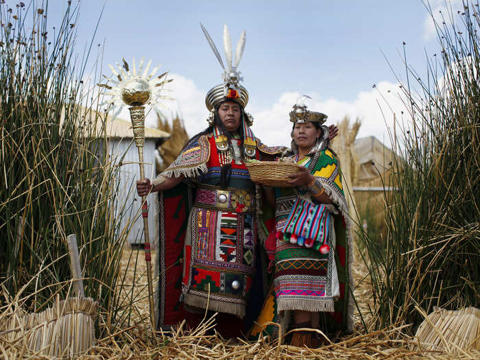 The Uros islands are a group of 70 man-made, floating islands on Peru’s Lake Titicaca. The Uros people fish and hunt, but tourism is their main source of livelihood. Here, an Andean man and a woman depicting Inca