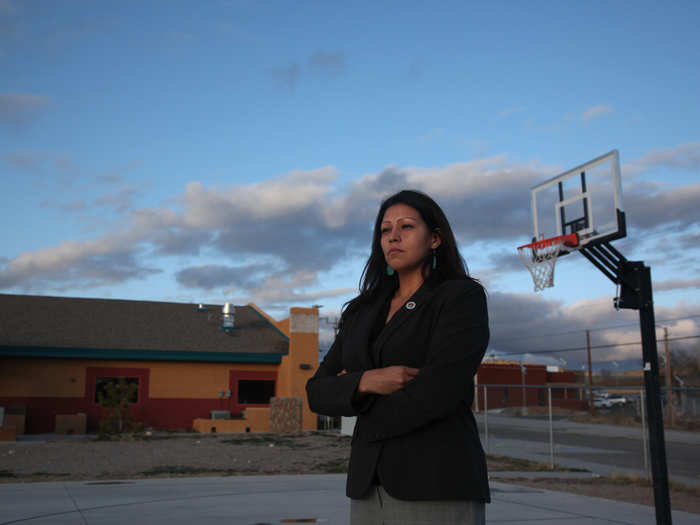 A Hualapai Tribe councilwoman stands near new buildings on the Hualapai Indian Reservation in Peach Springs, Arizona. The tiny Hualapai nation, in a bold move that could serve as a test of the limits of the sovereign power of Native American tribes over non-members, exercised its right of eminent domain to take over the management of the site and kick out the non-Indian developer.