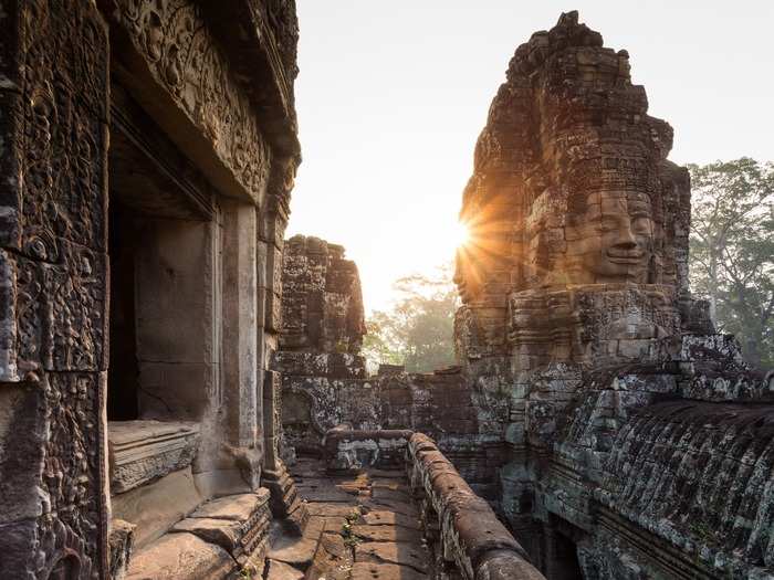 Angkor Thom is another huge structure. Spread across four square miles and boasting a fortified wall and moat, it’s said to have been the world