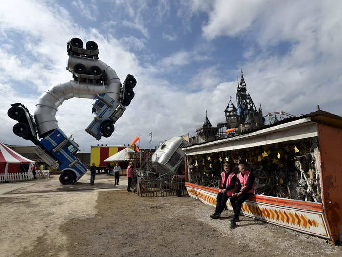 This installation, called "Big Rig Jig," depicts two oil trucks entwined in a frantic dance.