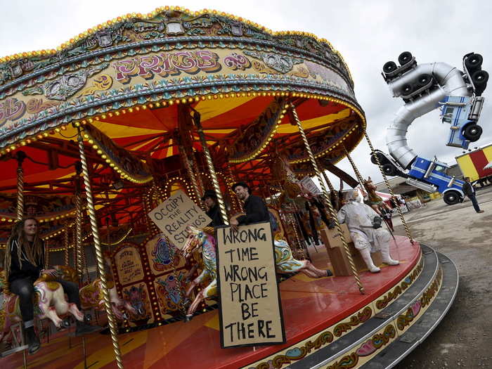 A garish carousel is running, but something isn