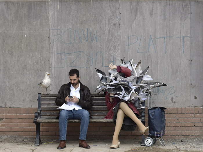 A sculpture of a woman is engulfed by seagulls, a reference to the increasingly aggressive gulls of the English coast that recently made the news.