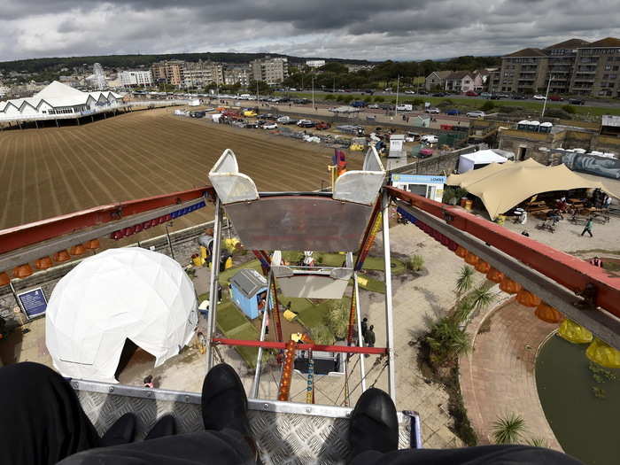 The rickety Ferris wheel offers an aerial view of the park and its surrounding area.