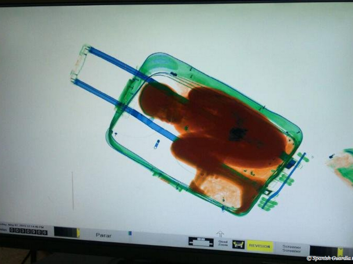 Spanish airport authorities saw an 8-year-old boy inside of a suitcase during an X-ray scan.