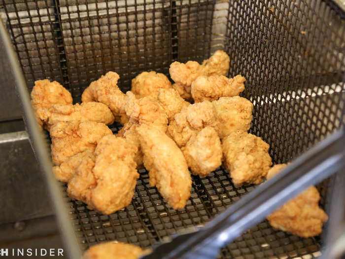 The boneless chicken wings are frozen en route, and appear to have a thick layer of batter.