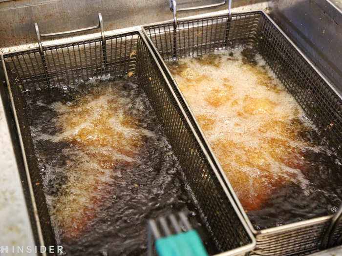 Into the fryer they go! The wings cook for 11 minutes, which seems like forever compared to the speedy service at fast-casual restaurants like Chipotle. But they never sit out under a heat lamp.