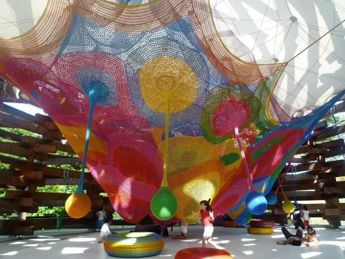 Tezuka Architects brings fantasies to life with its Woods of Net playground in Hakone, Japan. Japanese net artist Toshiko Horiuchi Macadam knitted this rainbow nest by hand for children to crawl, jump, and roll around in.