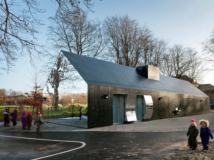 To the absolute delight of children in the area, architecture company MLRP transformed this existing playground in Copenhagen, Denmark, by adding funhouse mirrors to its pavilion.