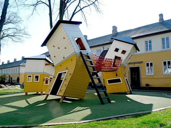 The design minds at MONSTRUM modeled this Brumlebyen area playground in Copenhagen, Denmark, after the terraced houses that populate the neighborhood. Playhouses feature climbing grips, slides, and balance lanes that connect the structures.