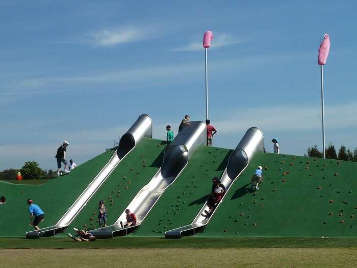 The Blaxland Riverside Park in Sydney, Australia, is the brainchild of JMD Design. The sleek playground is almost 1,000 feet in size and is equipped with tunnels, a large climbing net, a water play area, swings, and slides.