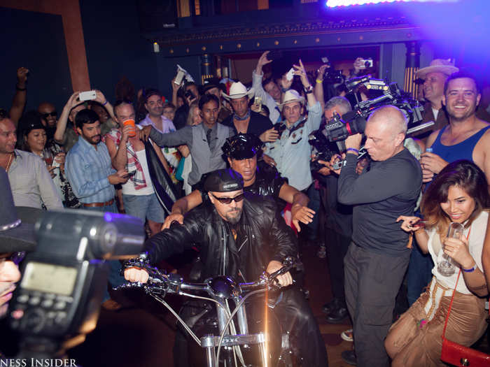 Finally, Sir Ivan arrived on a motorcycle — the crowd was excited to finally see the host.